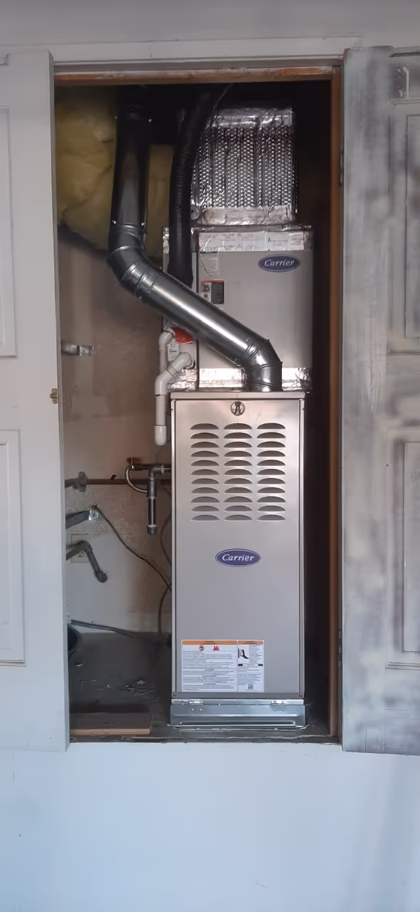 Upright residential furnace in utility space