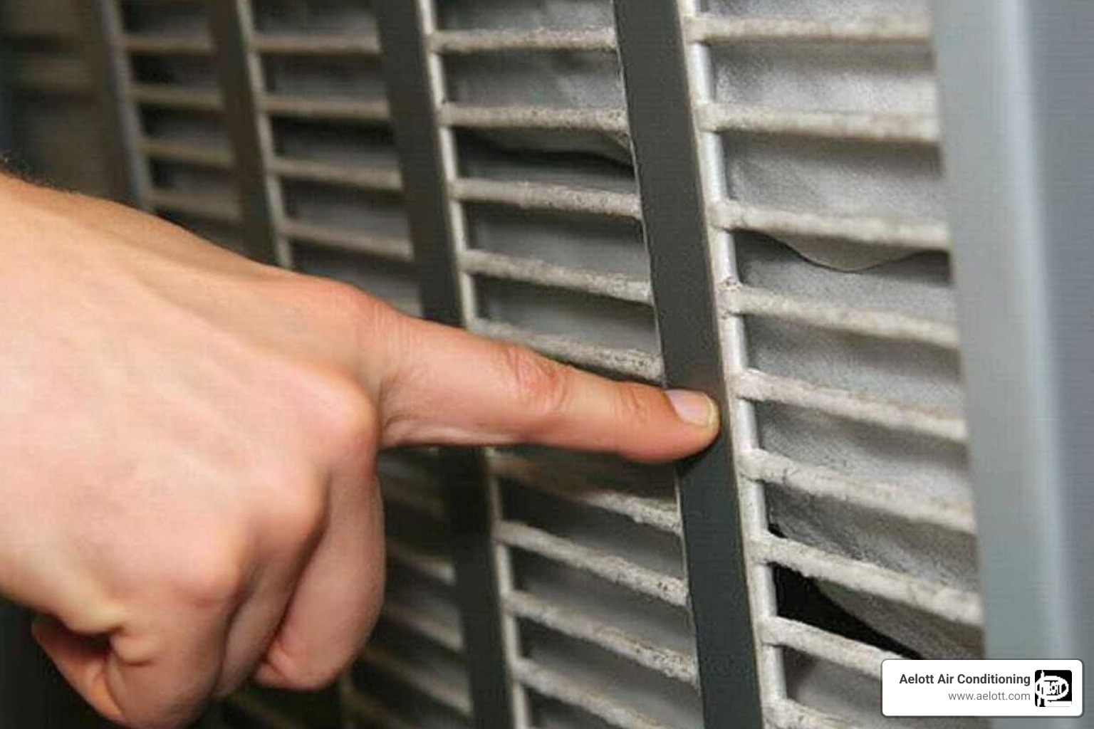 Person pointing to an HVAC filter slot - AC filter replacement Person pointing to an HVAC filter slot - AC filter replacement